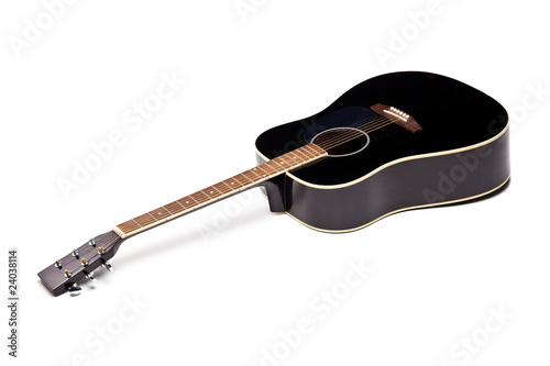 Elegance black shiny guitar isolated on white background photo