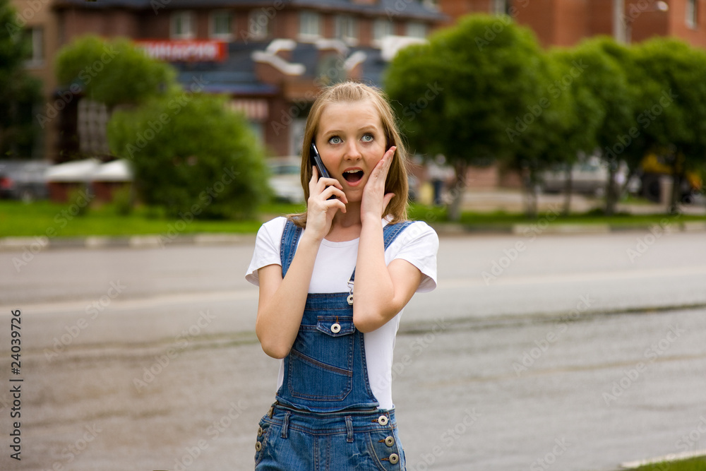 Woman is talking mobile phone outdoors. Woman is talking mobile phone outdoors.