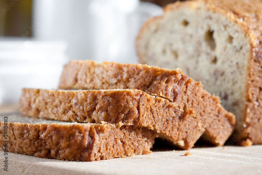 Delicious freshly baked banana bread on wooden board Delicious freshly baked banana bread on wooden board