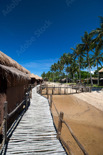 Row of traditional chalet at tropical resort
