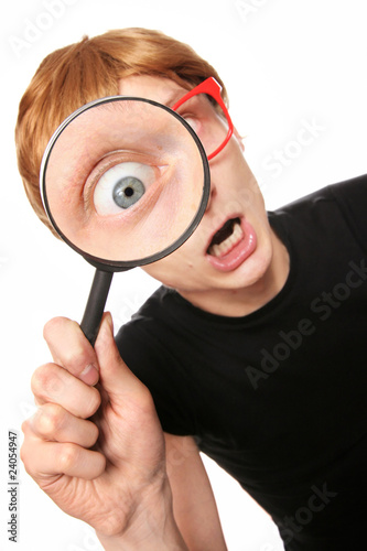 Excited nerd with magnifying glass