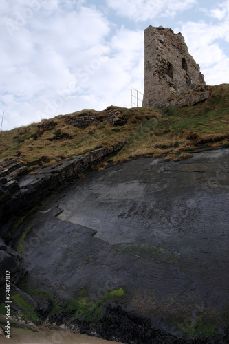 castle tower ruins on a high layered cliff