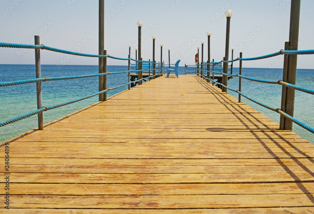 Wooden jetty on a tropical beach