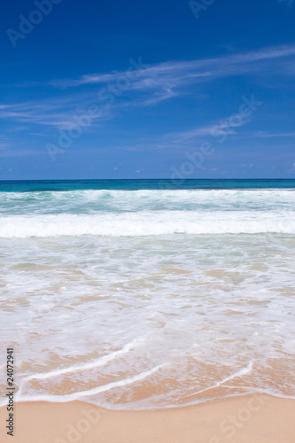 Beautiful beach with crashing waves in the tropics © Juriah Mosin