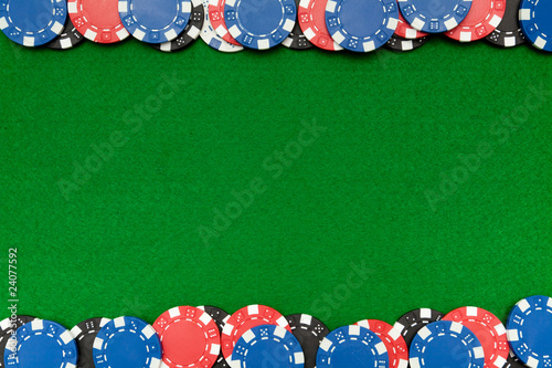 Gambling chips on green felt