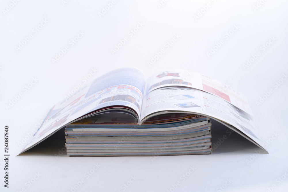 stack of colorful magazines stack of colorful magazines