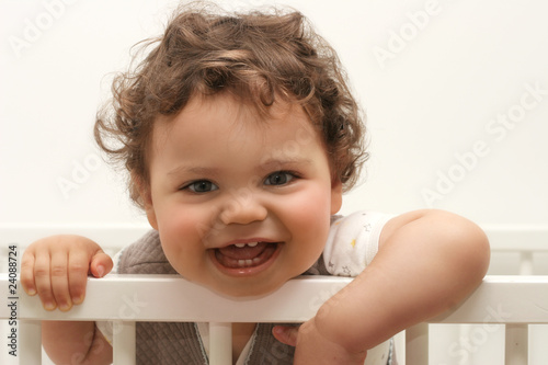 Beau Bebe Garcon Souriant Dans Son Lit Stock Photo Adobe Stock