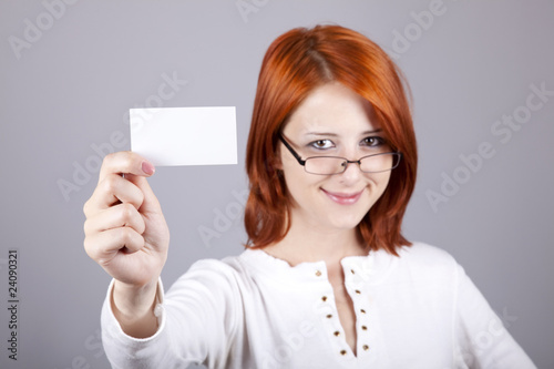 Portrait of an young beautiful happy woman with blank card