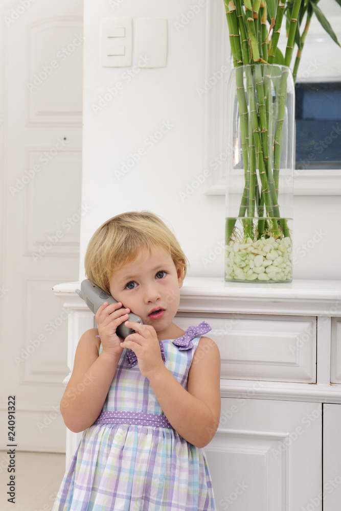 child talking on phone at home child talking on phone at home