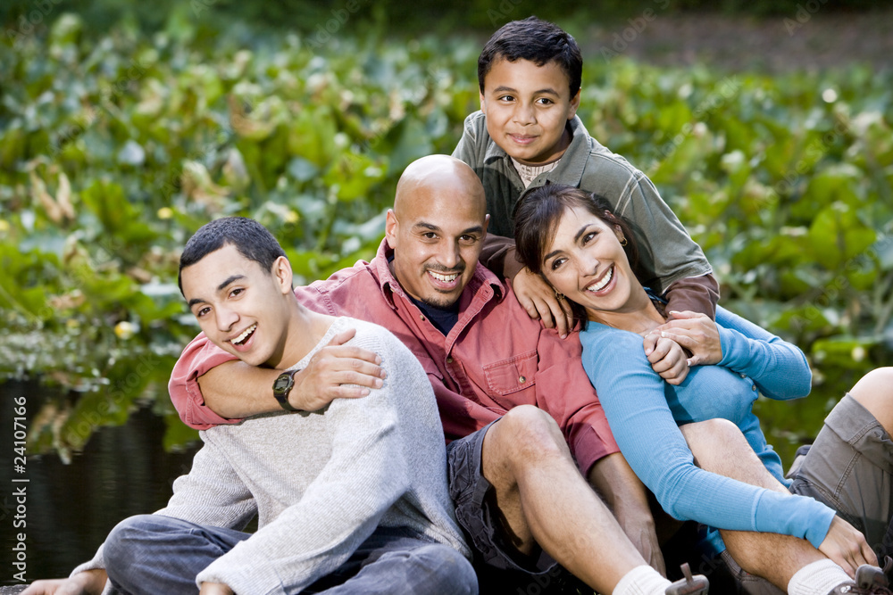 Portrait of Hispanic family with two boys outdoors Portrait of Hispanic family with two boys outdoors