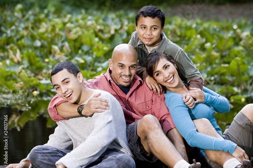 Portrait of Hispanic family with two boys outdoors