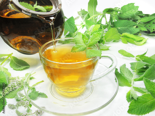 pouring tea with mint herb