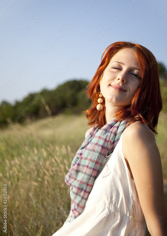 Fototapeta premium Girl at hill in sunrise.