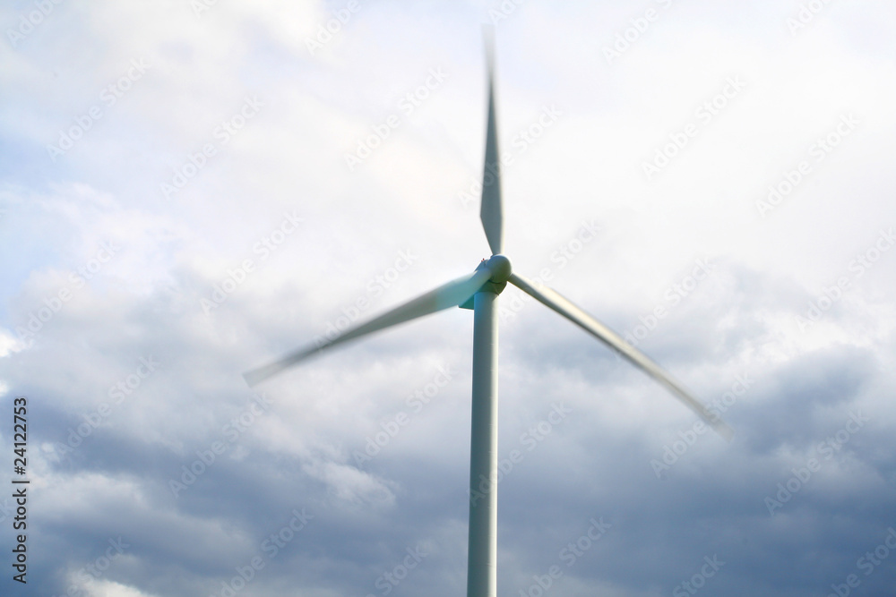 Fototapeta premium Wind turbines going fast giving power