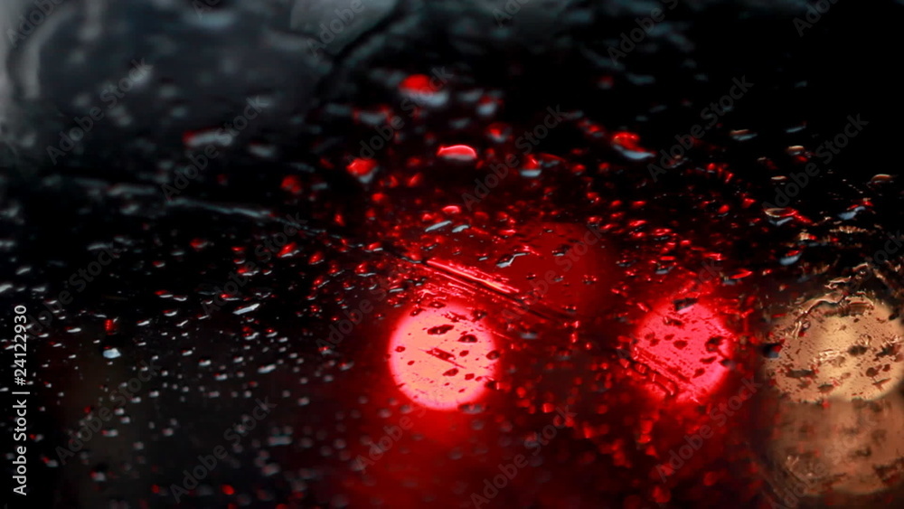 Rain drops with bokeh effect in the night city.