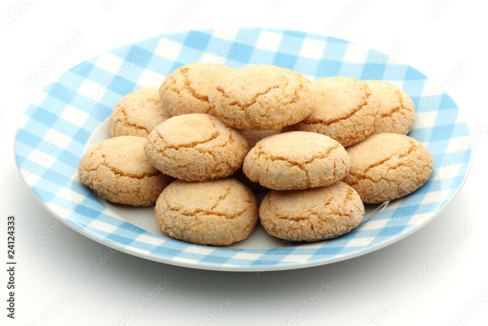 Traditional Italian biscuits on a plate on white background