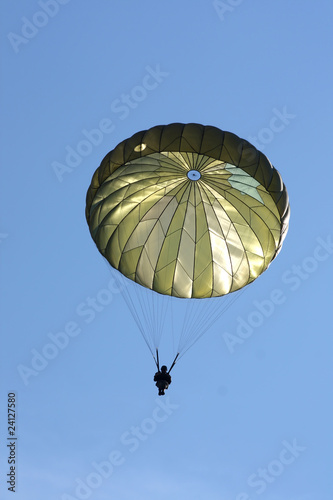 Paratrooper During a Military Drill with blu sky behind