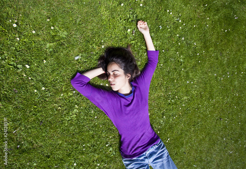 young girl relaxing on the grass