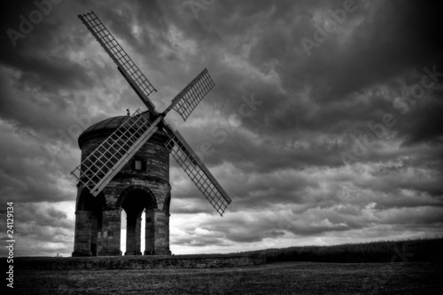 Chesterton Windmill with dark grey clouds and stormy sky