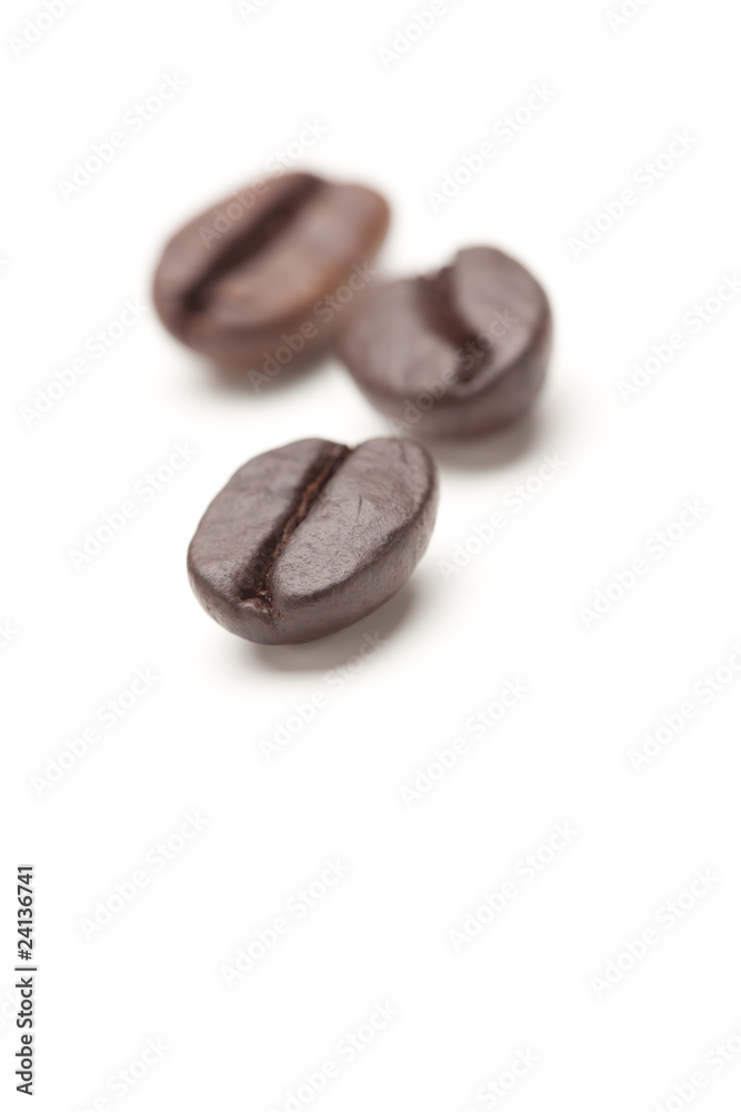 Naklejka premium Three Roasted Coffee Beans on White