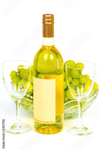 Bottle and grape in crystal vase
