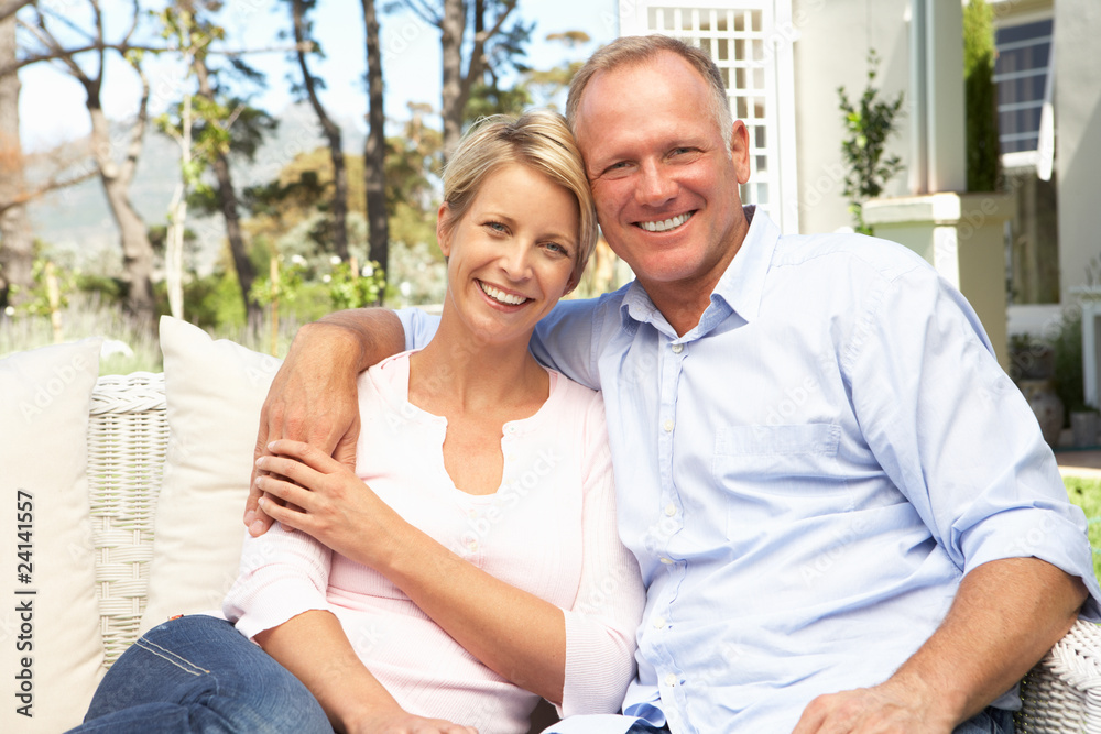 Couple Relaxing In Garden