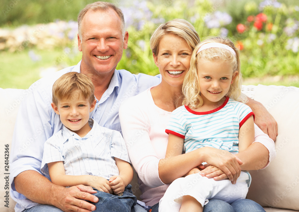 Family Relaxing In Garden