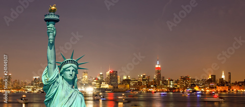 The Statue of Liberty and New York City skylines © Gary