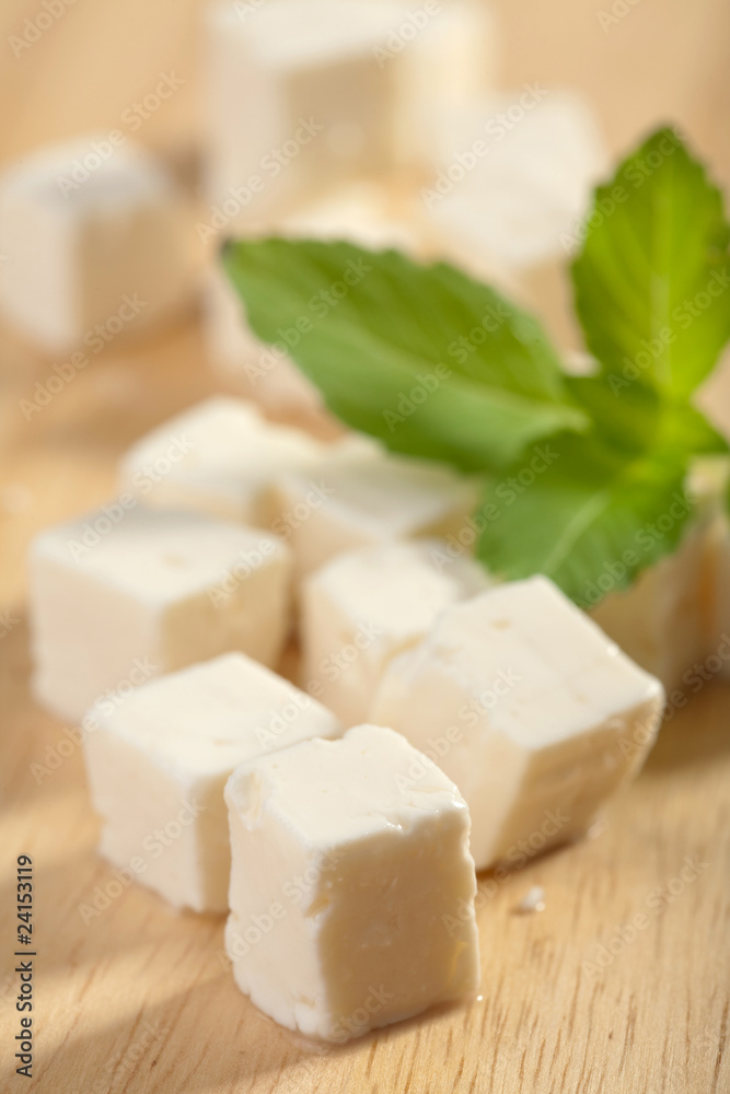 feta cheese on wooden cutting board feta cheese on wooden cutting board