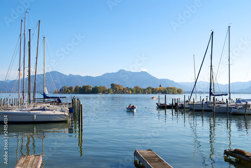 Sailing boats parking in the Chiemsee lake pier, Germany photo