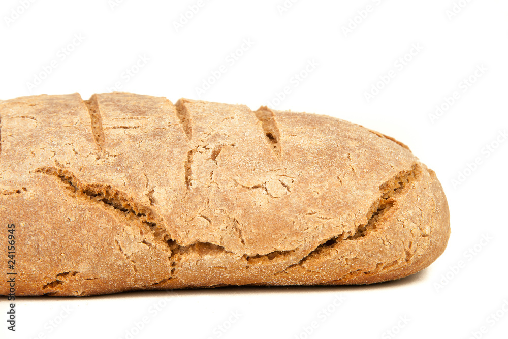 long loaf of hot whole rye kosher bread isolated on white