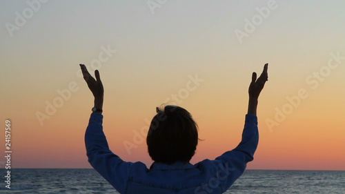 Woman's Hands Raised In Prayer
