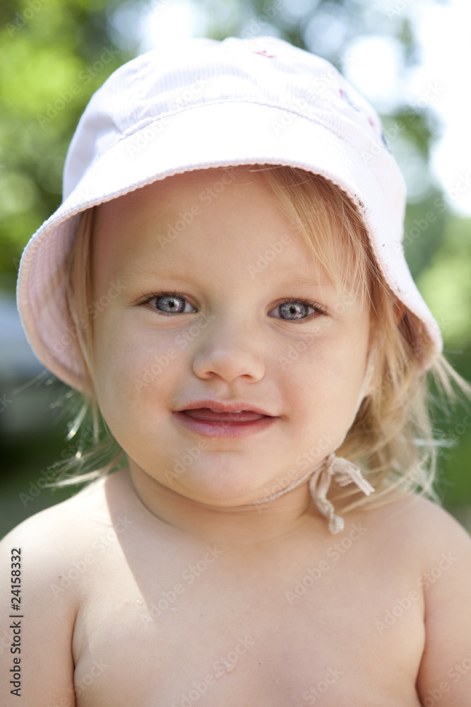 portrait of little blond girl with blue eyes wearing Panama portrait of little blond girl with blue eyes wearing Panama