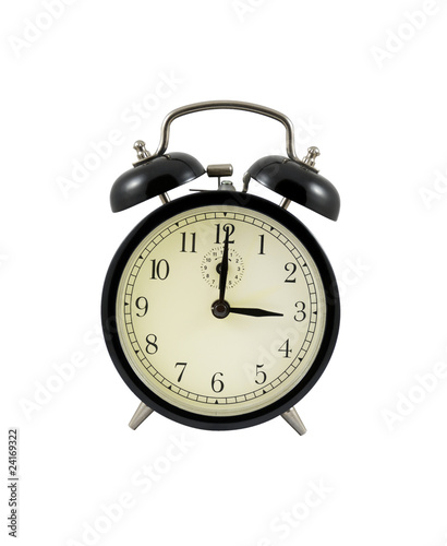 Retro alarm clock showing three hours