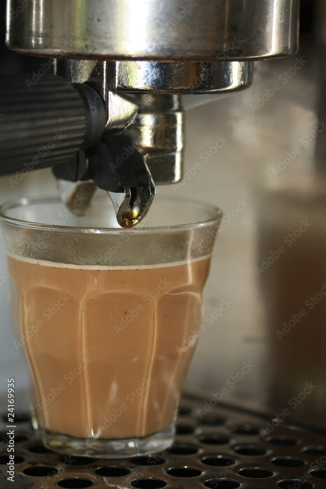 Latte macchiato under an espresso maker Latte macchiato under an espresso maker