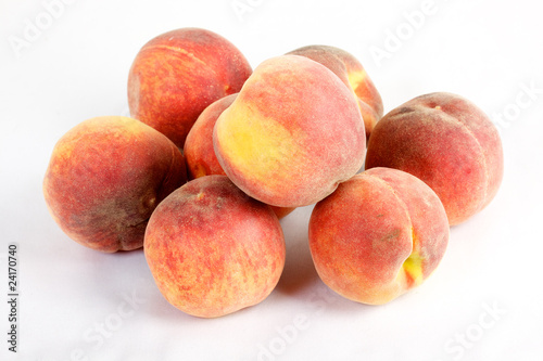 Fresh peaches - isolated on white
