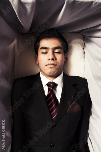 Photography photo of a man inside a coffin