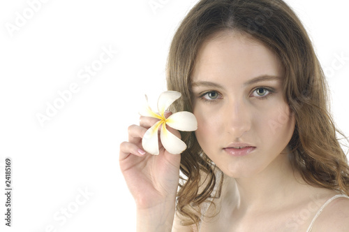 attractive young woman holding frangipani