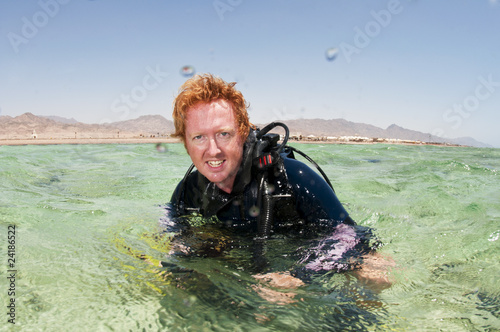 male scuba diver on surface