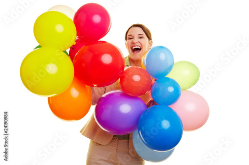 Geschäftsfrau feiert mit bunten Ballons