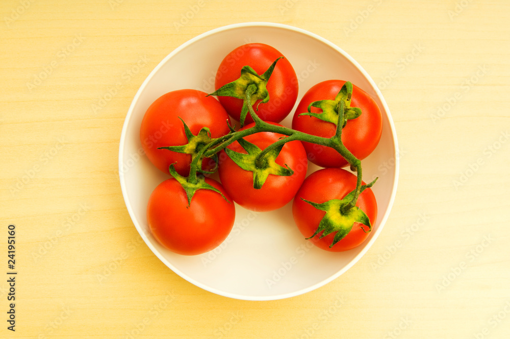 Red tomatoes isolated on the white background Red tomatoes isolated on the white background