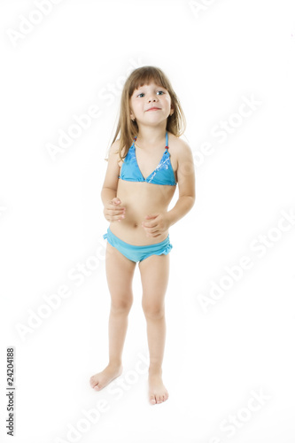 Little girl in bathing suit posing. Studio shoot