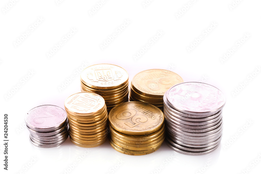 Many coins in column isolated on white Many coins in column isolated on white