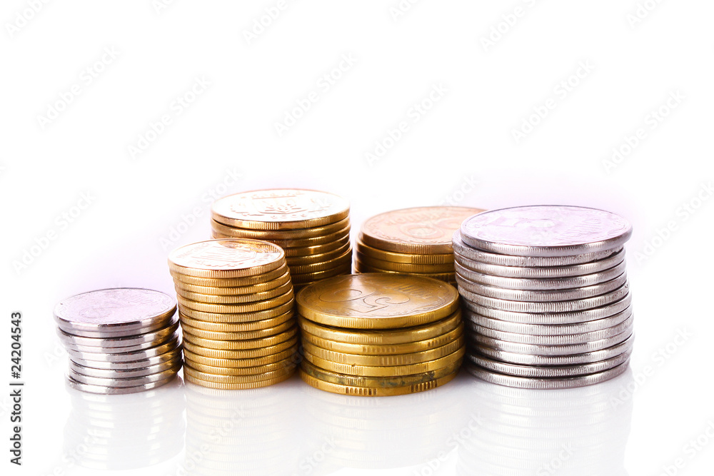 Many coins in column isolated on white Many coins in column isolated on white