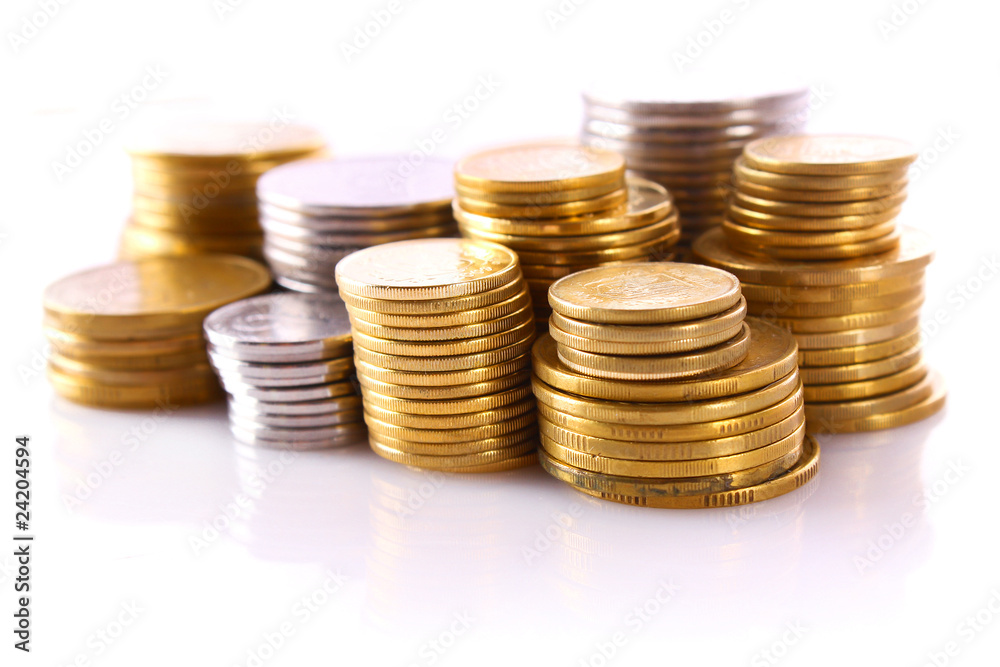 Many coins in column isolated on white Many coins in column isolated on white