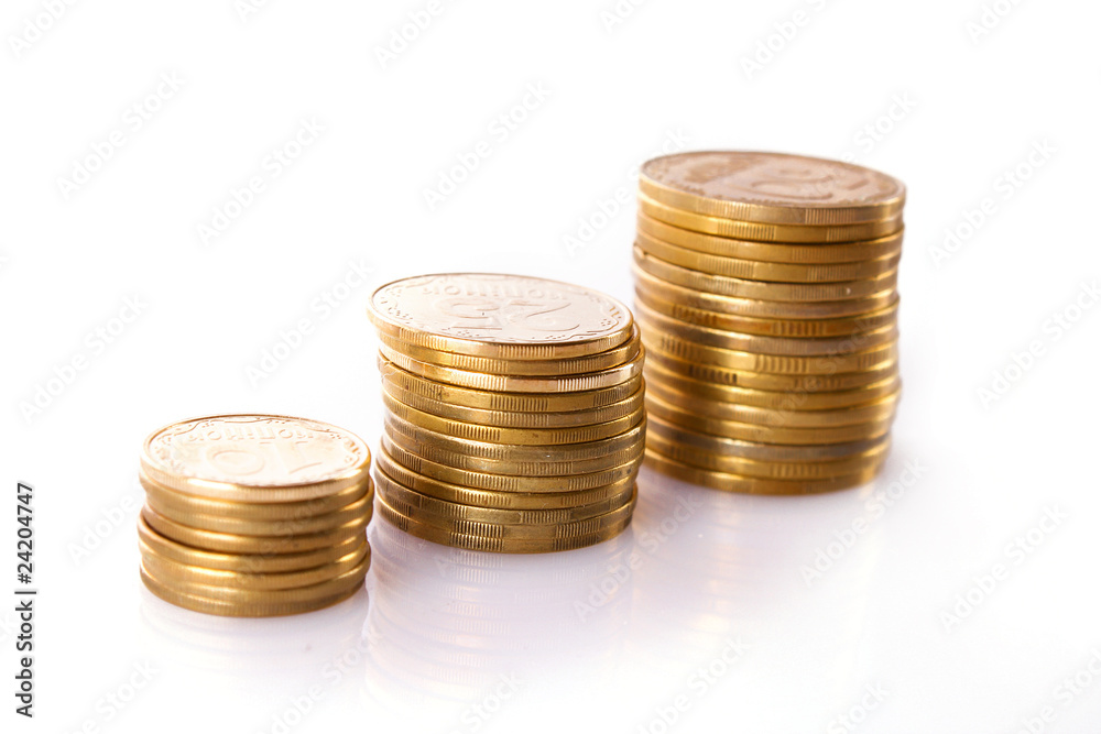Many coins in column isolated on white Many coins in column isolated on white