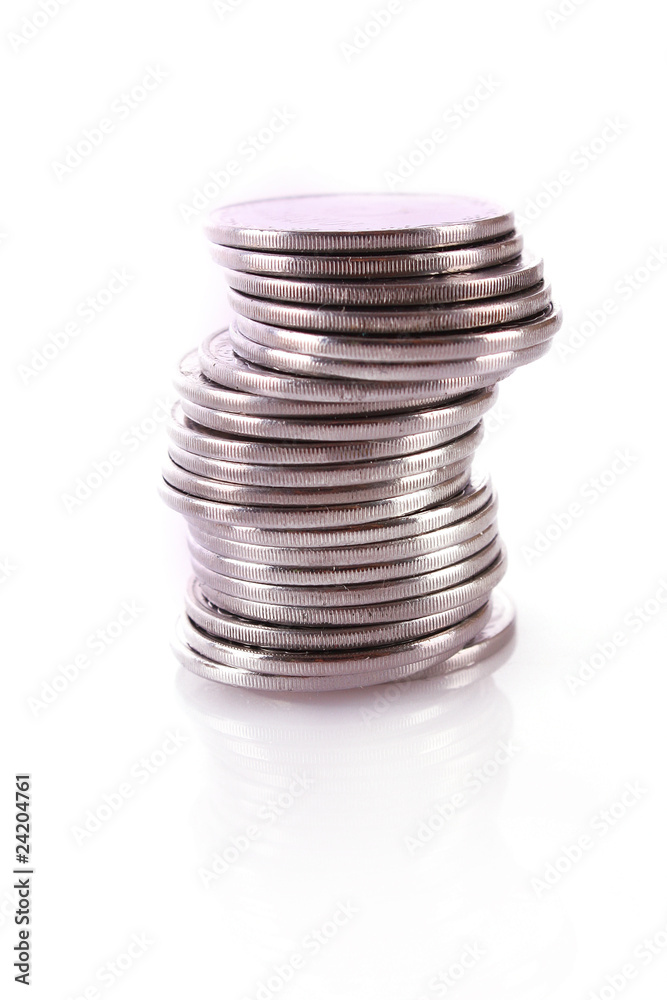 Many coins in column isolated on white Many coins in column isolated on white