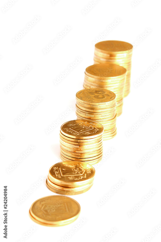Many coins in column isolated on white Many coins in column isolated on white