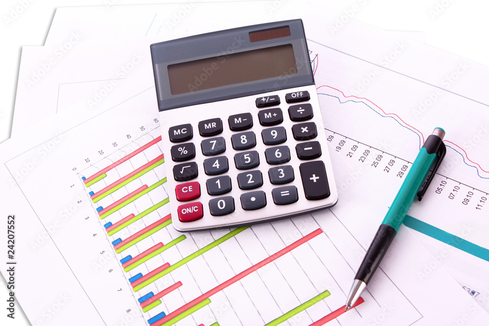 calculator and pen on chart background calculator and pen on chart background