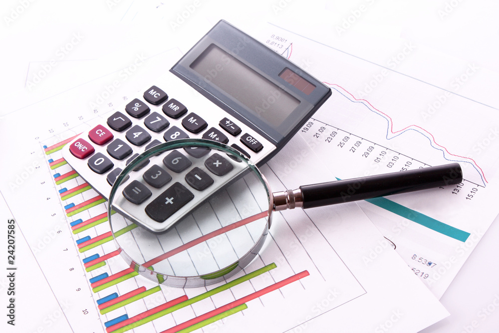 calculator and magnifier on chart background calculator and magnifier on chart background
